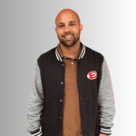 Man in a black and gray varsity jacket.