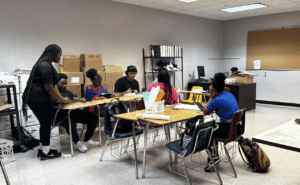 Students engaged in activities in a classroom.