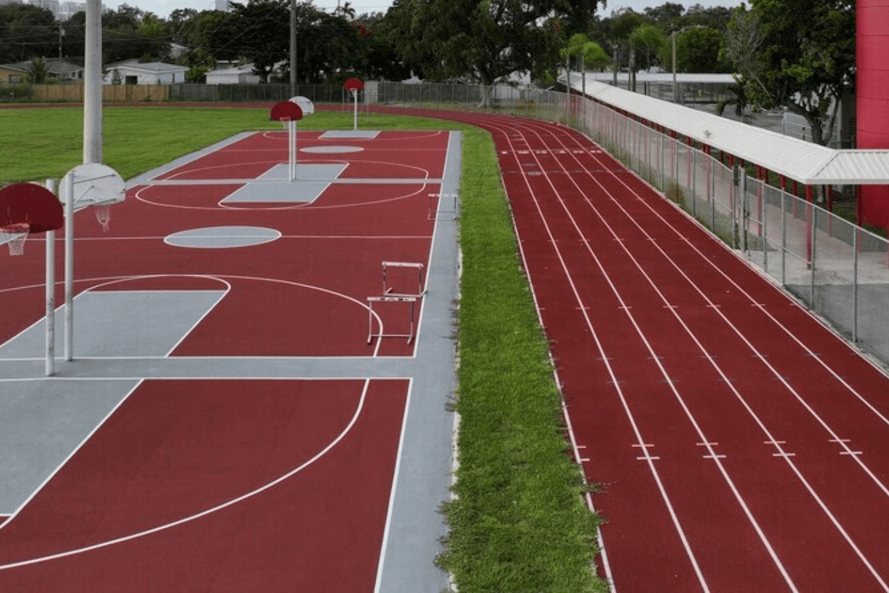 Basketball court and running track outdoors.